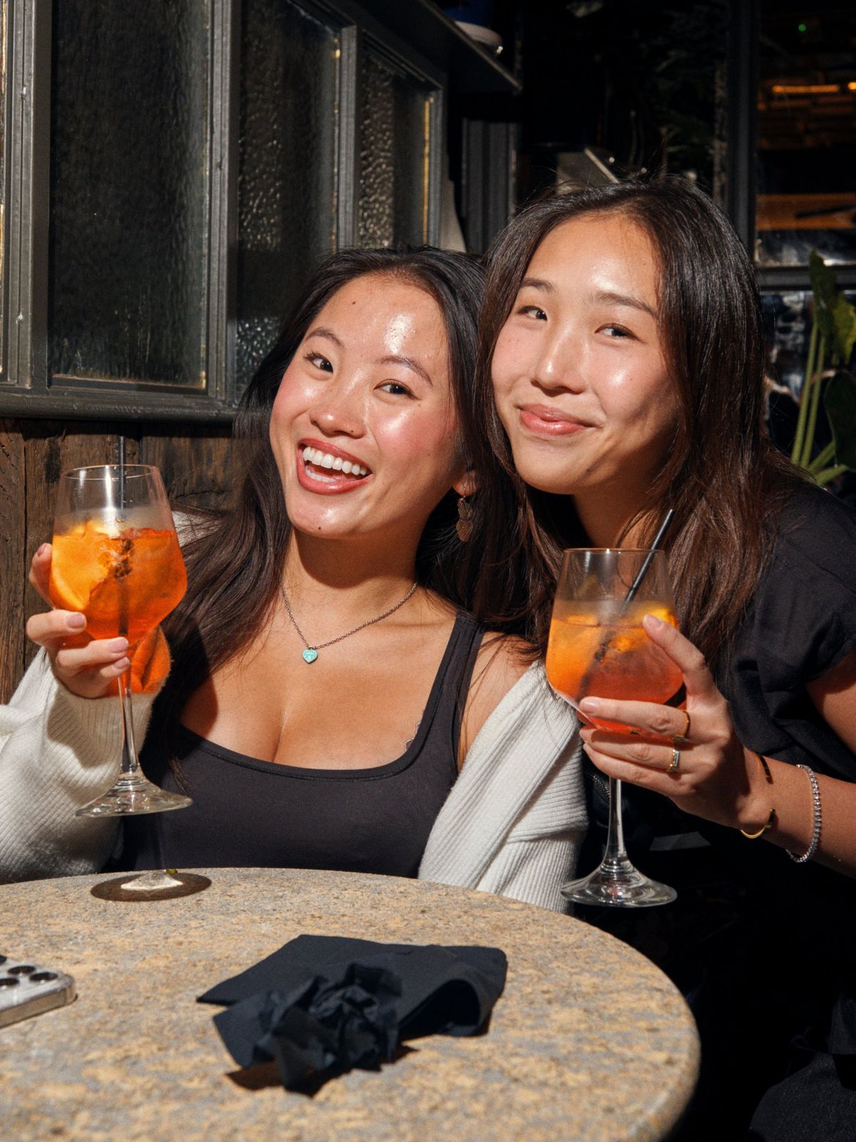 Friends with Aperol Spritzes at Saturday brunch